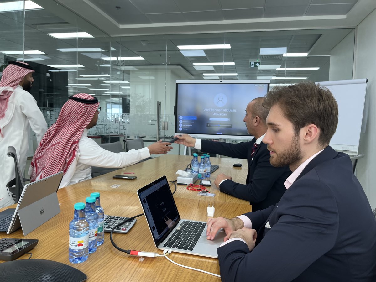 Solution demonstration in a Riyadh boardroom with client stakeholders.