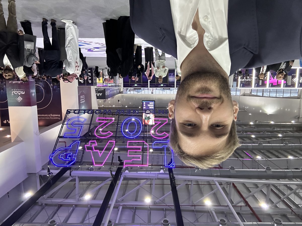 Michał Zieliński in front of the LEAP 2025 neon sign in Riyadh.